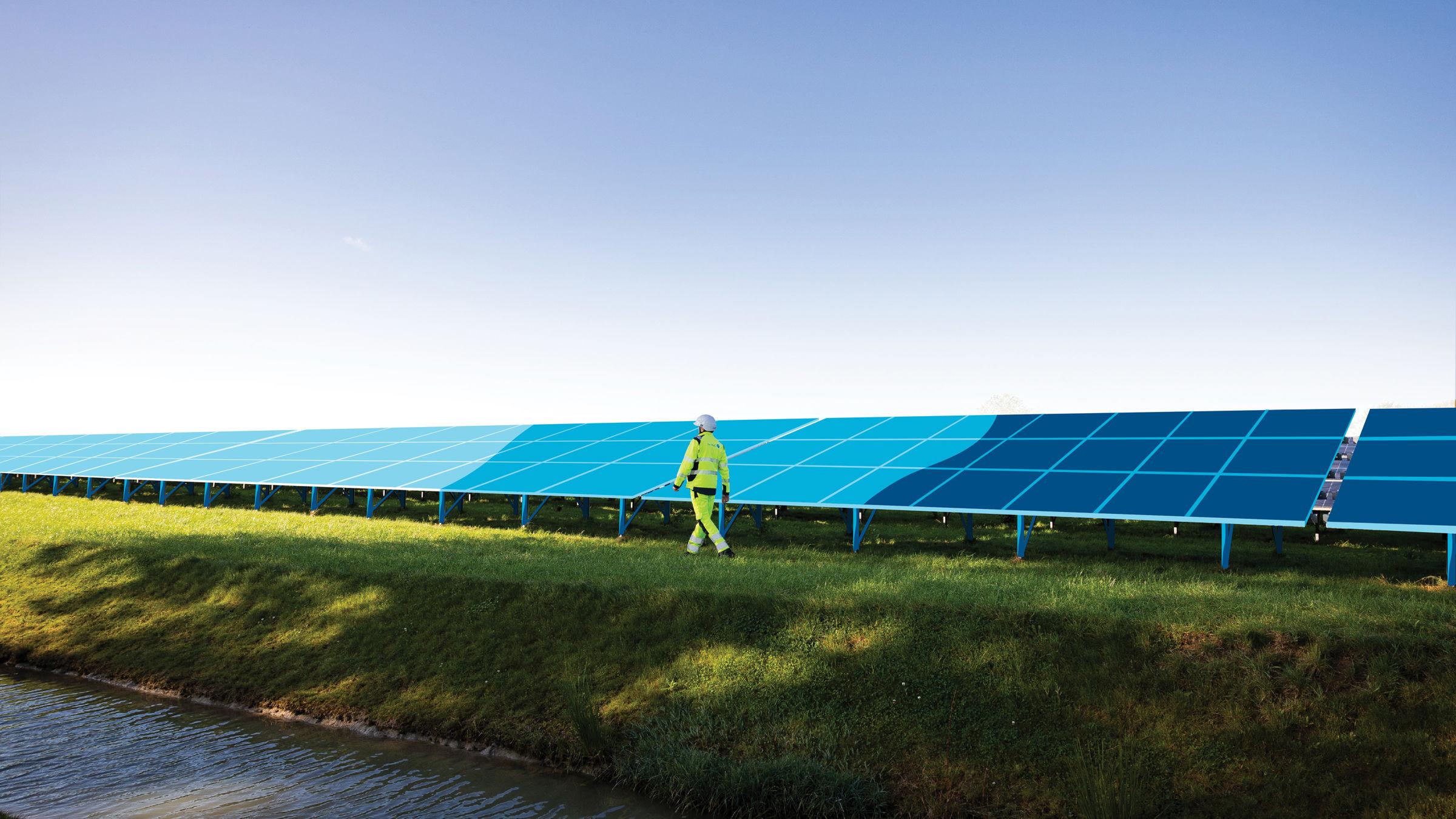 Man walking next to a solar panel